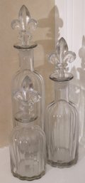 Decorative Glass Decanters With Fleur De Lis Stoppers From Two's Company, Includes 3 Bottles Ranging In Si