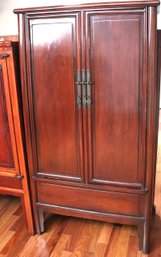Tall Chinese Armoire Cabinet In Beautifully Grained Richly Toned Wood With Metal Bracket Closure