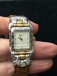 Womans Swiss Made Quartz Watch By Tabbah  Saga With Fine Detailed Design Around Face In Silver And Gold Tone