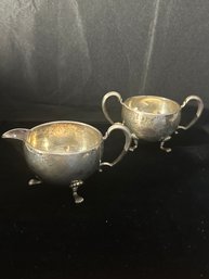 STERLING SILVER VINTAGE FOOTED SUGAR AND CREAMER SET WITH HANDLES