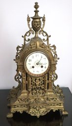 Renaissance Revival Style Brass Clock With Elaborate Scrollwork, White Enamel Face & Key