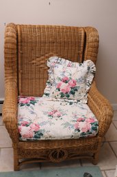 Natural Woven Wicker Wing Chair With Floral Pillow, By Henry Link Wicker.