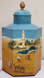 Oversized Hexagonal Toleware Canister Painted With An Arab Desert Oasis Scene.