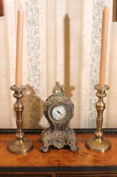 Home Decor Including Brass Candlesticks And An Ornate Battery-operated Clock