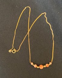 18K YG 15.5 Inch Pink Coral And Gold Graduating Beads Necklace - Signed