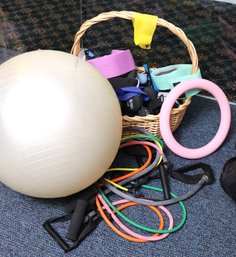Assortment Of Exercise Equipment Including Resistance Bands And Smaller Dumbbells