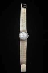 14K YG Ulysse Nardin Ladies Manual Wind Watch With Diamond Bezel And 14K Mesh Bracelet