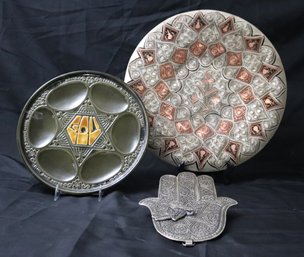 Three Middle Eastern Decorative Objects With Metal Hamsa, Etched Copper Platter And Ceramic Passover Plate.