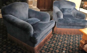 Pair Of Cozy Custom Swivel Chairs With A Navy Toned Microfiber Fabric And Tassel Accents