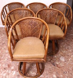 Six Vintage Midcentury Woven Rattan Swiveling Armchairs With Vinyl Ostrich Cushions