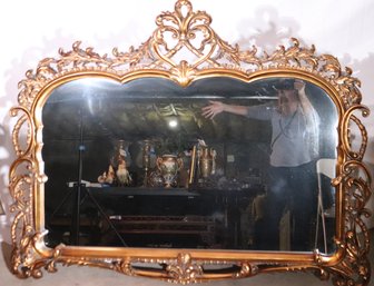Large Elaborate Gold Frame Wall Mirror With Pierced Leaf Design And Heart Shaped Crest