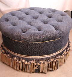Round Tufted Ottoman On Casters With Navy Blue Diamond Pattern Upholstery And Multi- Layer Fringe