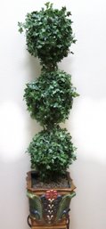 Faux Ivy Topiary In Ceramic Planter With Corinthian Design.