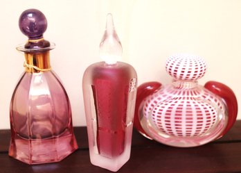 Collection Of Pink Decorative Perfume Bottles Including A Signed Bottle