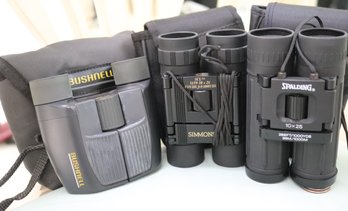 Binoculars -Simmons SCL 1159 10x25 1000 Yards, Spalding 10x25 1000yds And Bushnell 13-8230 8x23 1000 Yards