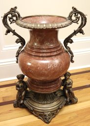 Large Bronze Mounted Marble Urn With Cherubs And Elaborately Curved Handles.