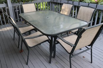 Samsonite Outdoor Glass Top Dining Table With Six Aluminum Mesh Aluminum Chairs.