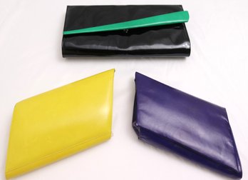 Three Vintage Charles Jordan Leather Clutch Bags With Rich Jewel Tone Colors