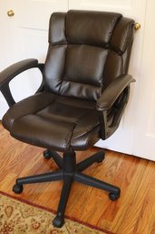 Adjustable Swiveling Leather Chair In A Faux Dark Brown Leather Fabric.