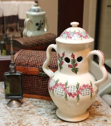 Italian Hand Painted Jar With Air Holes, A Moroccan Glass Perfume Bottle And Woven Basket Decor.