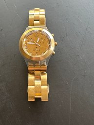 Gold Tone Swatch Watch With Large Face And White Hands