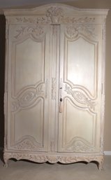 Whitewashed French Style Armoire With Two Doors And Interior Compartments.