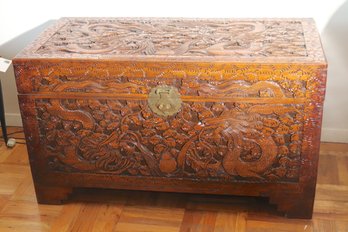 Highly Carved Camphor Wood Chinese Trunk With Dragons And Clouds.