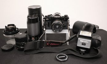 Vintage Canon A1 Camera With Assorted Accessories As Pictured
