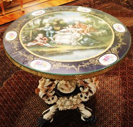 Stunning Hand Painted Porcelain Table With Cobalt Porcelain Base, Claw Feet, And Cavorting Cherubs.