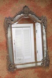 Ornate Metal Wall Mirror With Antiqued Glass & A Beveled Edge With A Rustic Finish