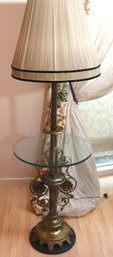 Antique Figural Brass And Glass Table Lamp With Pleated Fabric Shade.