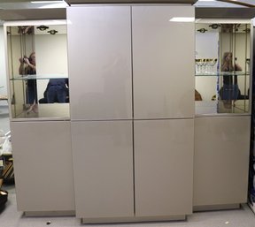 1980s Taupe Painted Glass Wall Unit With Mirrored Back Panels And Glass Shelves.