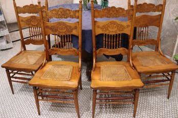 Embossed Oak Spindle Back Chairs Set Of Four With Cane Seats Good Condition.