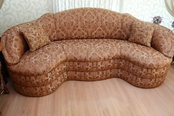 Art Deco Style Curved Sofa With Fortuny Style Upholstery.