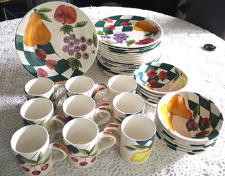 A Lot Of Ceramic Hand Painted Dishware With Plates And Coffee Mugs.