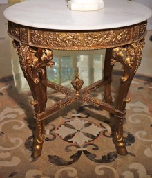 Luis XV Style Round Table With Beveled Marble, Gold Decoration And Embossed With Cherubs And Hoof Feet