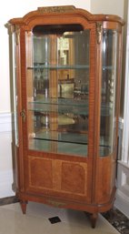 Early 20th C. Sophisticated Burlwood And Beveled Glass Display Cabinet With Mirrored Interior.