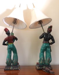 Pair Of Vintage Painted Chalk Ware Blackamoor Lamps With Linen Shades.