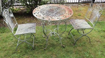 Outdoor Metal Bistro Table And Two Metal Chairs With Palm Tree Motif.