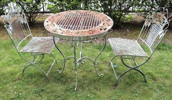 Outdoor Metal Bistro Table And Two Metal Chairs With Palm Tree Motif.