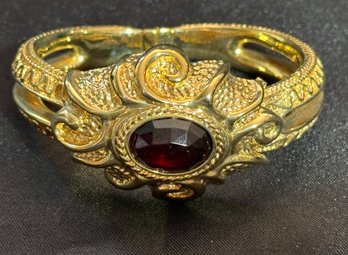 14K YG Fancy Hinged Hollow Bracelet With Large Faceted Garnet Center Stone-italy