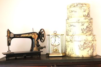Vintage Decor Includes A Singer Sewing Machine, Anniversary Clock From West Germany & Stackable Hat Boxes