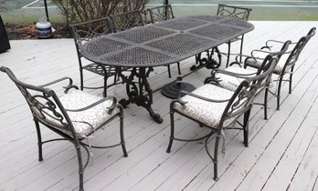 Ornate Outdoor Cast Aluminum Patio Set Including A Large Oval Table And Chairs