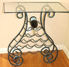 Ornate Wrought Aluminum Wine Rack With A Glass Top And Patinated Finish