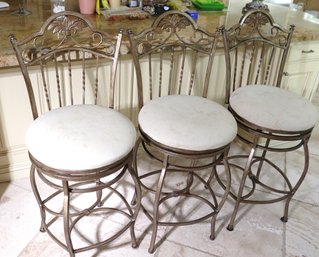 Three Metal Counter Stools With Leaf Motif On The Back.