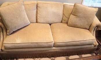 Cozy And Comfortable Henredon Sofa In A Light Golden Tone With Large Nail Head Accents And A Skirted Tassel