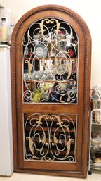 Fancy French Style Arched Cabinet With Gilt Metal Doors And Wine Bottle Storage.