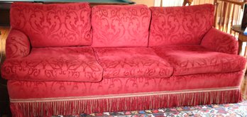 R Jones Custom Sofa Upholstered In A Red Scrolled Fabric Accented With A Tassel Skirt