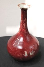 Smaller Oxblood Vase With Tapered Neck Signed On Underside.