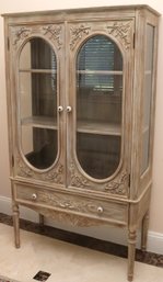 Lightwood Display Cabinet/ Curio With Oval Beveled Glass And Two Shelves.